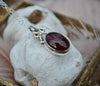 PENDANT, A Pool of Garnet Wrapped in Bows